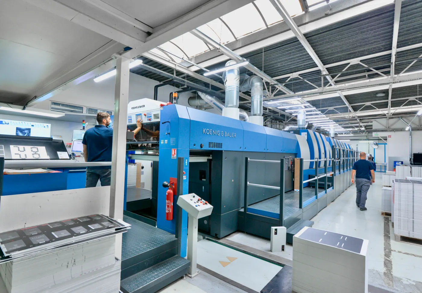A sheetfed offset press in a pressroom